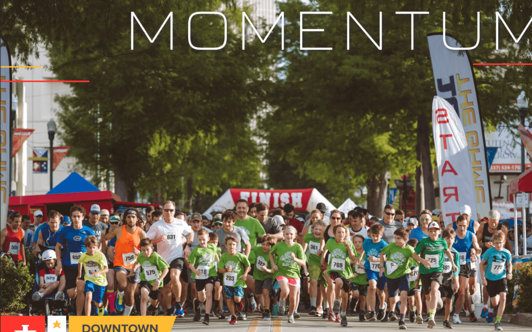 MOMENTUM Downtown Lafayette Annual Report 2019 (picture of runners at the start line of a race)