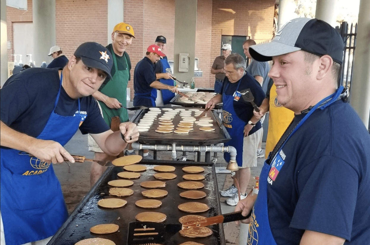Volunteers cooking pancakes
